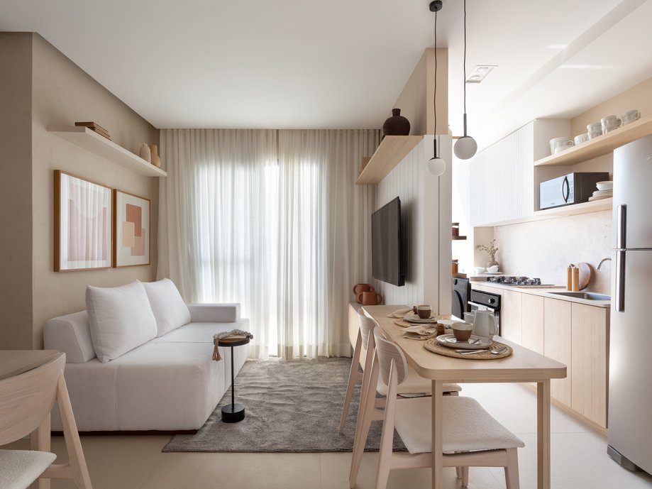 Apartamento pequeno bem planejado e decorado com tons claros.