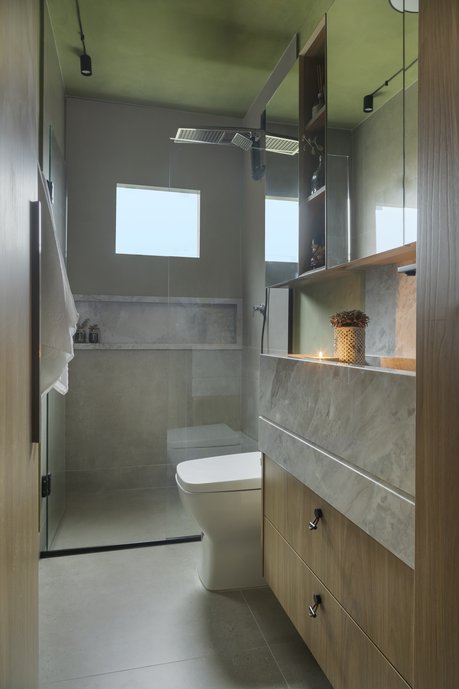 Projeto de um banheiro social contemporâneo utilizando o mesmo revestimento de chão para paredes do box, criando um conceito atemporal.