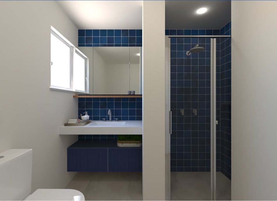 Um banheiro em tons de azul e marinho leve e versátil.