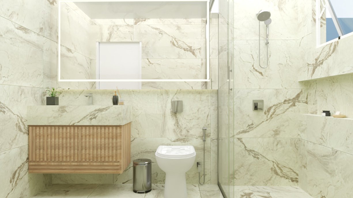Banheiro revestido com porcelanato marmorizado e bancada esculpida no mesmo porcelanato. 