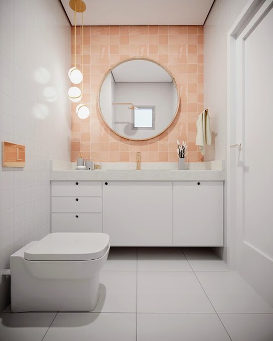 Banheiro com detalhes em rosa e dourado