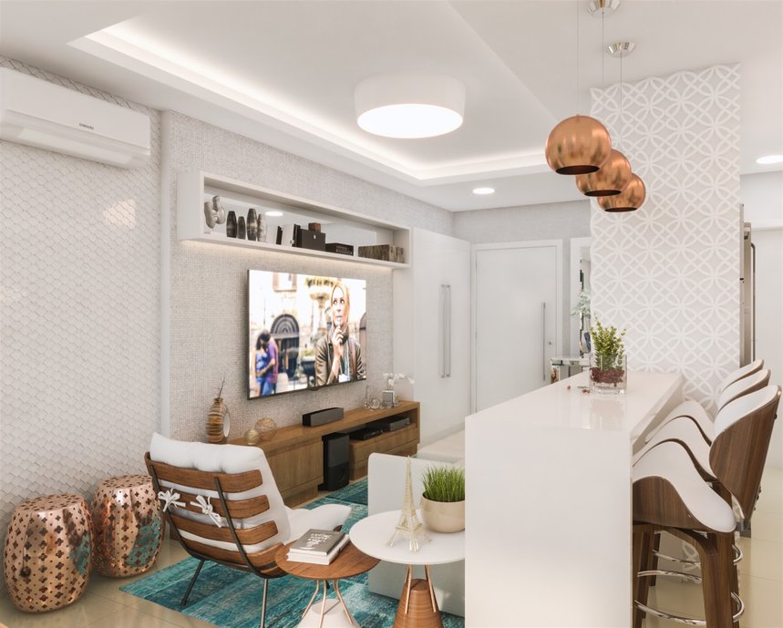 Móveis e iluminação com detalhes em rose gold complementam a ambientação.