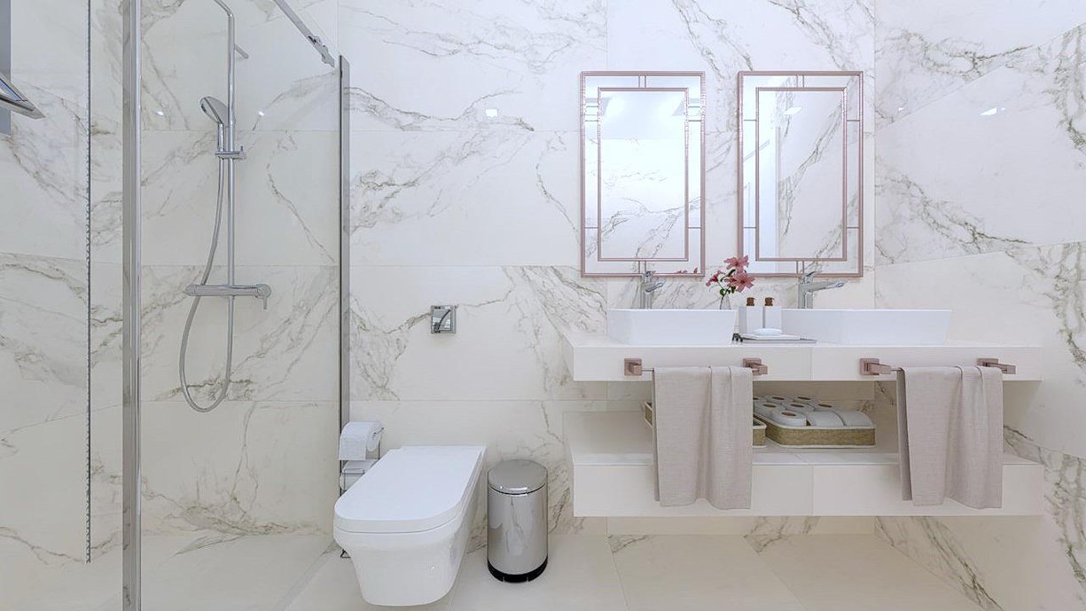 Suíte estilo clássica, revestida com o charmoso porcelanato marmorizado Golden Calacata. 