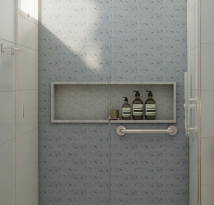 Os tons claros do azul e do branco trazem uma atmosfera clean e relax que era o desejo da cliente para a revitalização desse banheiro.