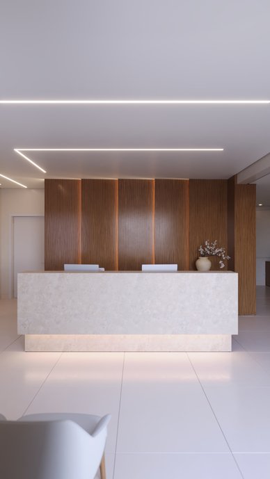 Reforma comercial no Bom Pastor, Rondonópolis. Marcenaria, LED e piso Mineral Off White Portobello criam uma recepção acolhedora.